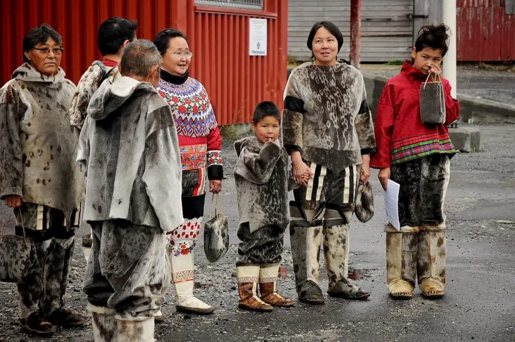 Aboriginal native eskimo people in a group waiting to welcome visitors to Nanortalik, Greenland - Can a Human Survive Eating Only Meat